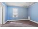 Bedroom with carpet, blue walls, window, and door at 5128 Lavista Rd, Tucker, GA 30084