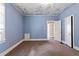 Bedroom with carpet, blue walls, window, and door at 5128 Lavista Rd, Tucker, GA 30084