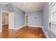A bright bedroom featuring hardwood floors and large windows at 5128 Lavista Rd, Tucker, GA 30084