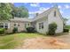 Charming home exterior with stone and siding accents and mature landscaping at 5128 Lavista Rd, Tucker, GA 30084