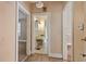 Hallway with wood floors and doors leading to a bathroom and other rooms at 5128 Lavista Rd, Tucker, GA 30084