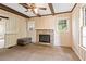 Living room featuring a stone fireplace and wooden ceiling beams at 5128 Lavista Rd, Tucker, GA 30084