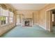 This living room features a fireplace, built-in shelving, and a large window for natural light at 5128 Lavista Rd, Tucker, GA 30084