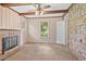 Living room featuring a stone fireplace and wooden ceiling beams at 5128 Lavista Rd, Tucker, GA 30084