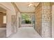 This sun room features stone walls and a window that provides natural light at 5128 Lavista Rd, Tucker, GA 30084