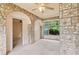 This sun room features stone walls and a window that provides natural light at 5128 Lavista Rd, Tucker, GA 30084