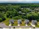 Aerial view of homes with green lawns and trees in a beautiful residential neighborhood at 6510 Boulder Rdg, Cumming, GA 30028