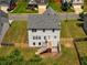 Aerial view of a home's backyard featuring a deck, stairs, and fenced yard at 6510 Boulder Rdg, Cumming, GA 30028