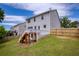 Large backyard with a wooden fence and a deck, perfect for outdoor activities at 6510 Boulder Rdg, Cumming, GA 30028