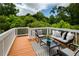 Inviting deck with comfortable outdoor furniture, perfect for relaxing and enjoying the view at 6510 Boulder Rdg, Cumming, GA 30028