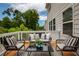 Cozy deck with outdoor seating, ideal for entertaining or enjoying the surrounding scenery at 6510 Boulder Rdg, Cumming, GA 30028
