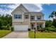 Charming two-story home with brick and siding, well-manicured lawn, and attached two-car garage at 6510 Boulder Rdg, Cumming, GA 30028