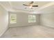 Spacious main bedroom with ceiling fan and large windows providing plenty of natural light at 6510 Boulder Rdg, Cumming, GA 30028