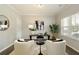 Cozy home office with a large window, modern desk, comfortable chairs, and stylish decor at 6510 Boulder Rdg, Cumming, GA 30028