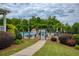 Charming landscaped entrance to community pool area with manicured bushes and pergola entrance at 6510 Boulder Rdg, Cumming, GA 30028