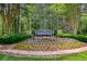Community entrance sign, Parkstone, surrounded by flowers and lush greenery at 6510 Boulder Rdg, Cumming, GA 30028