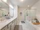 Elegant bathroom featuring double sinks, a separate shower, and a luxurious soaking tub at 2506 Skyland Ne Dr # 17, Atlanta, GA 30319
