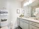 Bathroom with a sleek white vanity, ample counter space, and a decorative mirror and towels at 2506 Skyland Ne Dr # 17, Atlanta, GA 30319