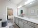 Luxurious bathroom boasting dual sinks, a large mirror, and a stylish seating area at 2506 Skyland Ne Dr # 17, Atlanta, GA 30319