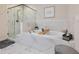 The soaking tub features marble surround, a shower, and a neutral color palette at 2506 Skyland Ne Dr # 17, Atlanta, GA 30319