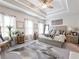 Bright bedroom featuring a tray ceiling, ceiling fan, and neutral color palette with natural light at 2506 Skyland Ne Dr # 17, Atlanta, GA 30319