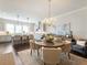 Open dining area featuring hardwood floors, stylish chandelier, and views of the modern kitchen at 2506 Skyland Ne Dr # 17, Atlanta, GA 30319