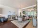 Open dining area featuring hardwood floors, stylish chandelier, and views of the adjacent living spaces at 2506 Skyland Ne Dr # 17, Atlanta, GA 30319