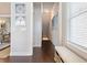 Inviting hallway with hardwood floors, bench seating, and elegant wall art at 2506 Skyland Ne Dr # 17, Atlanta, GA 30319