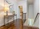Upstairs hallway with decorative table, lamp, and artwork and a view to the bedroom at 2506 Skyland Ne Dr # 17, Atlanta, GA 30319