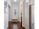 Bright hallway with hardwood floors, bench with storage and access to other rooms at 2506 Skyland Ne Dr # 17, Atlanta, GA 30319