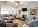 Open living room featuring a fireplace, coffered ceilings, and seamless flow to the dining area at 2506 Skyland Ne Dr # 17, Atlanta, GA 30319