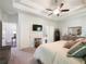 Another view of main bedroom featuring tray ceiling, ceiling fan, and ensuite bathroom at 2506 Skyland Ne Dr # 17, Atlanta, GA 30319