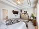 This expansive main bedroom features a tray ceiling, neutral walls, and cozy decor at 2506 Skyland Ne Dr # 17, Atlanta, GA 30319