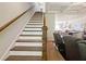 Classic staircase with wooden railings and white risers, leading to the upper level of the home at 2506 Skyland Ne Dr # 17, Atlanta, GA 30319
