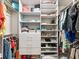 Custom walk-in closet with built-in shelves and hanging rods to maximize storage space at 2506 Skyland Ne Dr # 17, Atlanta, GA 30319