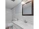 Bright bathroom features a tub with white tile surround and a vanity with a white countertop at 3626 Buford Ne Hwy # C1, Brookhaven, GA 30329