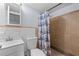 Cozy bathroom with shower, commode, sink and bright nautical patterned shower curtain at 3626 Buford Ne Hwy # C1, Brookhaven, GA 30329