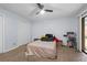 Spacious bedroom featuring a ceiling fan, closet and a sliding glass door that provides lots of light at 3626 Buford Ne Hwy # C1, Brookhaven, GA 30329