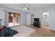 Bedroom includes a ceiling fan, closet, and a sliding glass door with outdoor access at 3626 Buford Ne Hwy # C1, Brookhaven, GA 30329