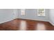 Hardwood flooring in a living room with natural light coming through the windows at 3626 Buford Ne Hwy # C1, Brookhaven, GA 30329