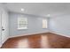 Hardwood flooring in a living room featuring two windows, providing abundant natural light at 3626 Buford Ne Hwy # C1, Brookhaven, GA 30329