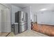 Stainless steel refrigerator near a door, with hardwood flooring leading to a living area at 3626 Buford Ne Hwy # C1, Brookhaven, GA 30329