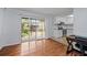 Living room featuring wood floors, access to patio, and view of the kitchen at 3626 Buford Ne Hwy # C1, Brookhaven, GA 30329