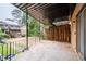 Private outdoor patio with metal railing and partial shade from above at 3626 Buford Ne Hwy # C1, Brookhaven, GA 30329