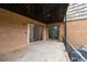 Spacious covered outdoor patio space with access from multiple rooms and neutral carpet at 3626 Buford Ne Hwy # C1, Brookhaven, GA 30329