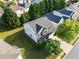 Aerial view of a two story home with a large backyard, lush landscaping, and a two-car garage at 5909 Rue Chase Way, Tucker, GA 30084