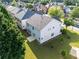 Aerial view of a home with a large backyard, patio, and a well-maintained lawn at 5909 Rue Chase Way, Tucker, GA 30084
