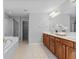 Bathroom boasts double vanity, soaking tub and glass enclosed shower at 5909 Rue Chase Way, Tucker, GA 30084