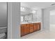Bathroom boasts double sink vanity with tiled floors and modern fixtures at 5909 Rue Chase Way, Tucker, GA 30084