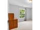 Neutral bedroom with a wood desk and a large window with natural light at 5909 Rue Chase Way, Tucker, GA 30084